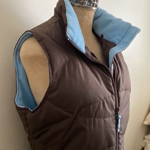 Brown and light blue vest.